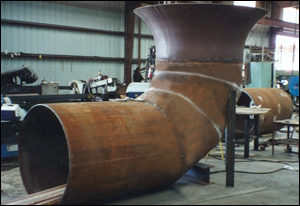 Bellmouth reducer with a mitered elbow